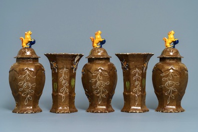 Une garniture de cinq vases en fa&iuml;ence de Delft polychrome &agrave; fond brun capucin, 18&egrave;me