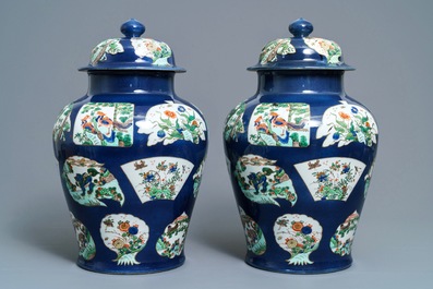 A pair of famille verte powder blue-ground vases and covers, Samson, Paris, 19th C.