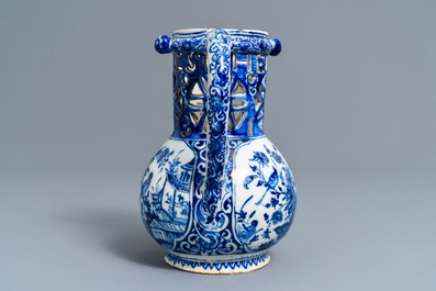 A Dutch Delft blue and white chinoiserie puzzle jug, dated 1743