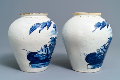 A pair of Dutch Delft blue and white tobacco jars with native American indians, 18th C.