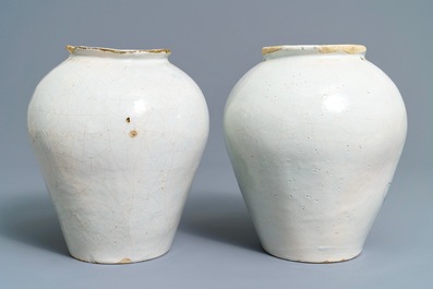 A pair of Dutch Delft blue and white tobacco jars with native American indians, 18th C.