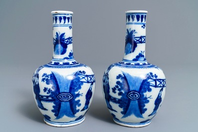 A pair of Dutch Delft blue and white chinoiserie bottle vases, 1st half 18th C.