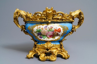 A pair of massive gilt bronze-mounted S&egrave;vres porcelain ewers and a jardini&egrave;re, France, 19th C.