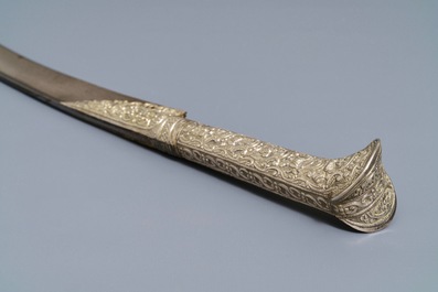 An Ottoman silver-mounted Damascus steel 'yatagan' sword in its leather sheath, Turkey, 19th C.