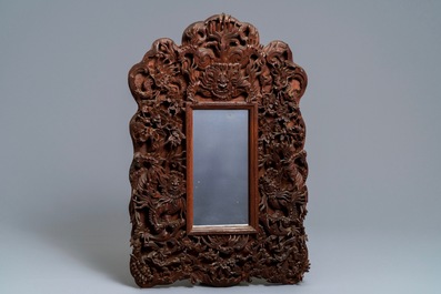 Two Chinese carved wood frames with dragons and figures, ca. 1900