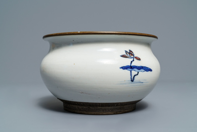 A Chinese blue, white and underglaze red censer, a wall pocket vase and a monochrome blue vase, 19/20th C.