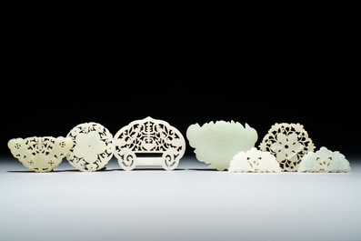 Seven Chinese white and celadon jade buttons, 18/20th C.