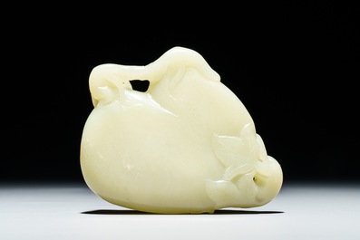 A Chinese celadon jade brush washer with monkeys on peaches, 19/20th C.