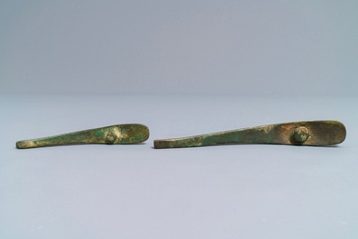 Two Chinese inlaid bronze belt hooks and a bronze ornament, Zhou or Han