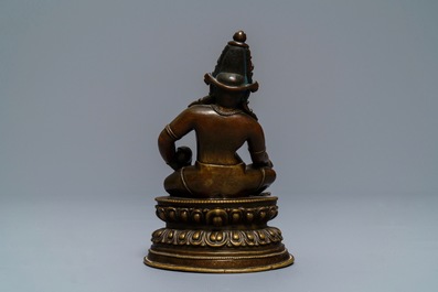 A Sino-Tibetan bronze figure of Jambhala, 17/18th C.