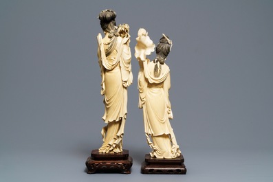 Two tall Chinese ivory carvings of ladies with flowers, 19th C.