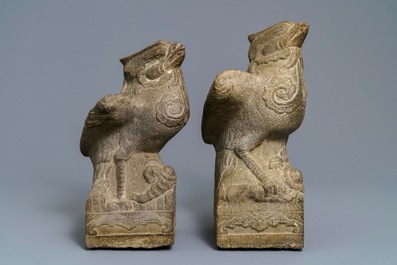 A pair of large Chinese carved stone 'phoenix' figures, Yuan or Ming