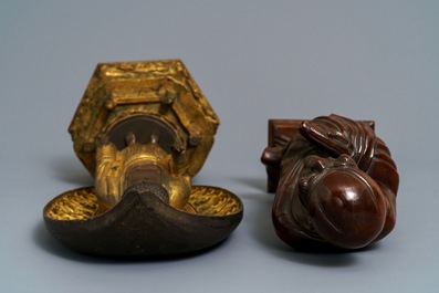 A Japanese giltwood figure of Buddha and a 'Daruma' okimono, Meiji, 19th C.