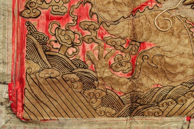 A pair of large Chinese relief-embroidered silk 'dragon' panels, 19th C.