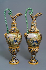 A pair of massive Italian maiolica ewers with figures in landscapes, 19th C.