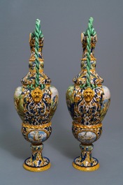 A pair of massive Italian maiolica ewers with figures in landscapes, 19th C.