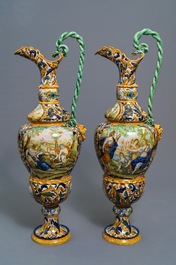 A pair of massive Italian maiolica ewers with figures in landscapes, 19th C.