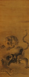 Japanese school, 18/19th C., after Kano Masanobu, ink on silk: A tiger on a rock