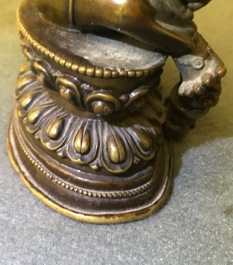A Sino-Tibetan bronze figure of Jambhala, 17/18th C.