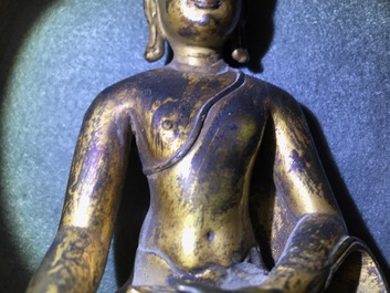 A gilt bronze figure of Buddha Shakyamuni, Tibet, 14/15th C.