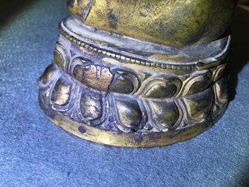 A gilt bronze figure of Buddha Shakyamuni, Tibet, 14/15th C.