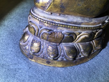 A gilt bronze figure of Buddha Shakyamuni, Tibet, 14/15th C.