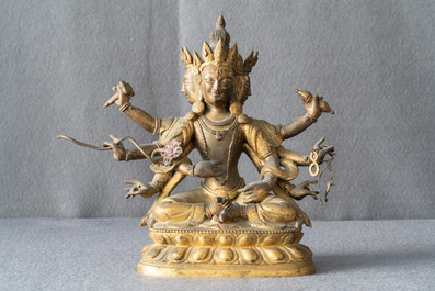 A Sino-Tibetan inlaid gilt bronze figure of Ushnishavijaya, 18th C.