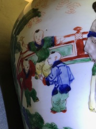 A Chinese wucai vase and cover with figures in a garden, seal mark, Transitional period