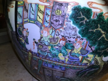 A large Chinese famille verte fish bowl with a narrative scene all-round, 19th C.