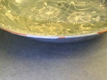 A Chinese Swatow celadon slip-decorated blue-ground dish, Ming