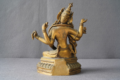 An inlaid gilt bronze figure of Vasudhara, Tibet or Nepal, 18/19th C.