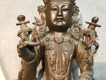 A Chinese bronze figure of Guanyin, Ming