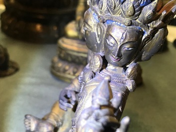 A Sino-Tibetan inlaid gilt bronze figure of Ushnishavijaya, 18th C.