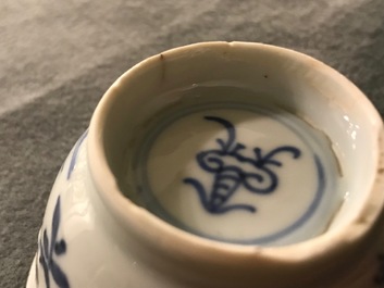 A pair of Chinese blue, white and underglaze red cups and saucers, Kangxi
