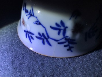 A pair of Chinese blue, white and underglaze red cups and saucers, Kangxi