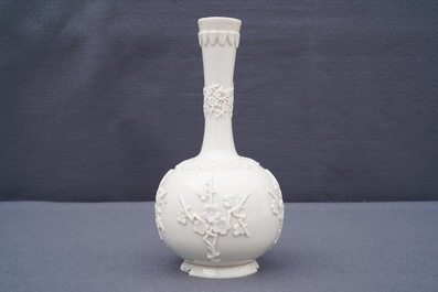 A Chinese Dehua blanc de Chine vase with applied floral designs, Kangxi