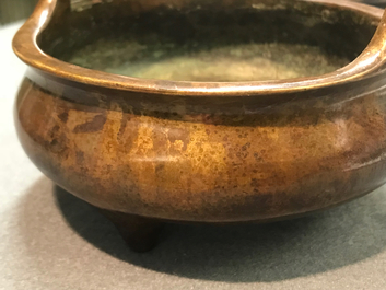 A Chinese bronze tripod censer, Xuande mark, 19th C.