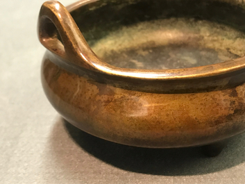 A Chinese bronze tripod censer, Xuande mark, 19th C.