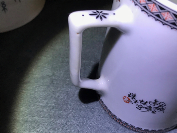 A Chinese polychrome 'winter landscape' teapot and a covered mug, 20th C.