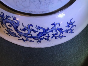 A Chinese Canton enamel dish with figures in a garden, Qianlong mark and of the period