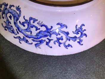 A Chinese Canton enamel dish with figures in a garden, Qianlong mark and of the period