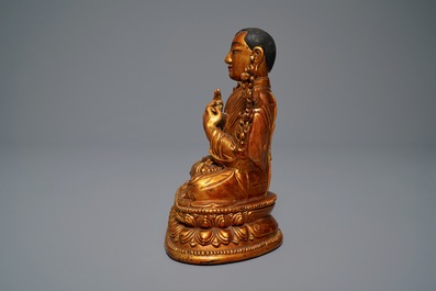 A large Chinese carved lacquered giltwood figure of Tsongkhapa, 18th C.