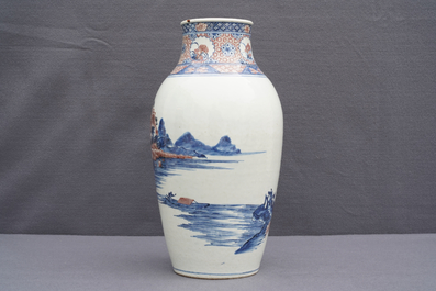 A Chinese blue, white and underglaze red landscape vase, 19th C.