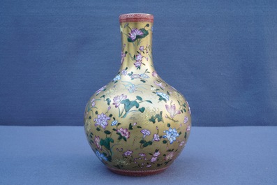 A Chinese famille rose gilt-ground bottle vase with floral design, Qianlong mark, 19/20th C.