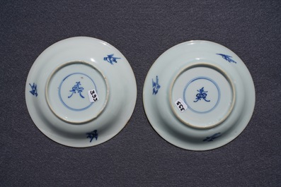 A pair of Chinese blue, white and underglaze red cups and saucers, Kangxi