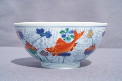 A Chinese doucai bowl with fish in a lotus pond, Xuande mark, Kangxi