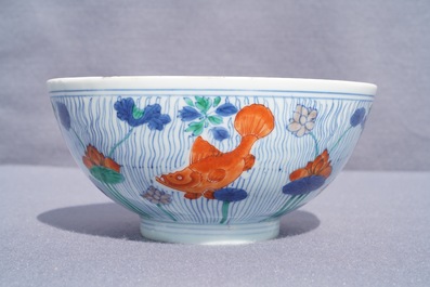 A Chinese doucai bowl with fish in a lotus pond, Xuande mark, Kangxi