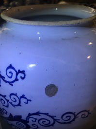 A pair of large Dutch Delft blue and white tobacco jars with brass covers, 18th C.