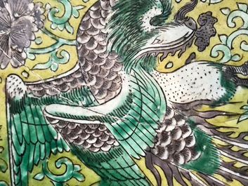 A Chinese green, yellow and aubergine-glazed biscuit 'phoenixes' dish, He He Jia Chan mark, Transitional period