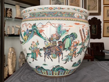 A large Chinese famille verte fish bowl with a narrative scene all-round, 19th C.